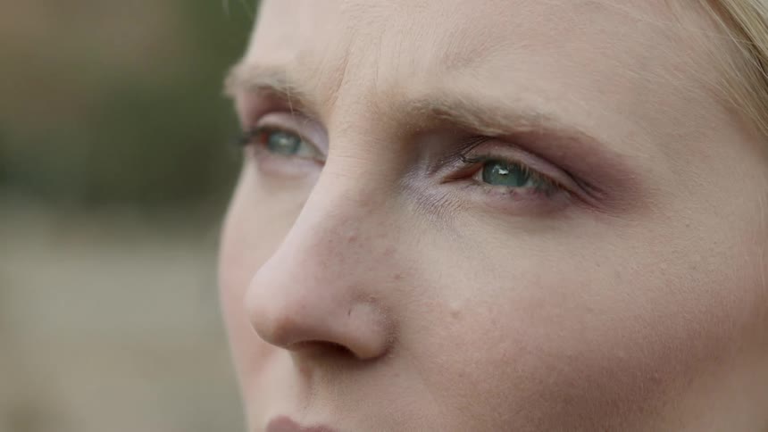 A woman looks up at the sky