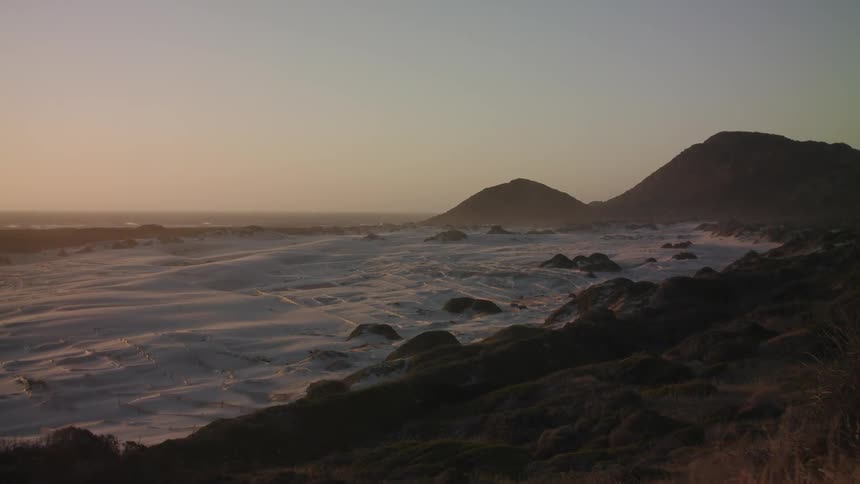 The sun is nearly sit over the beach