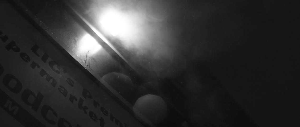 Smoke rising towards a single light