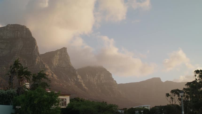 The clouds are rolling over the mountains in the fog ahead