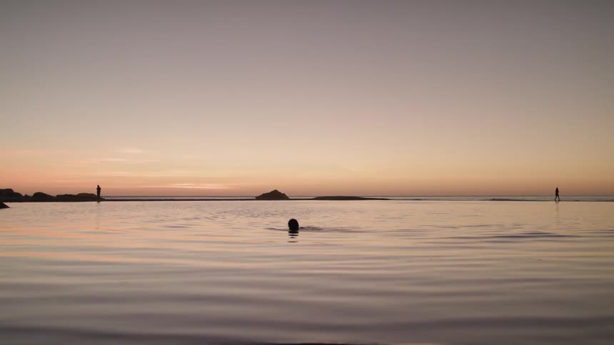 A man wades in neck high water