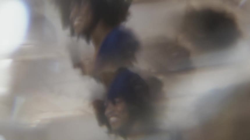 Woman is seen through a kaleidoscope