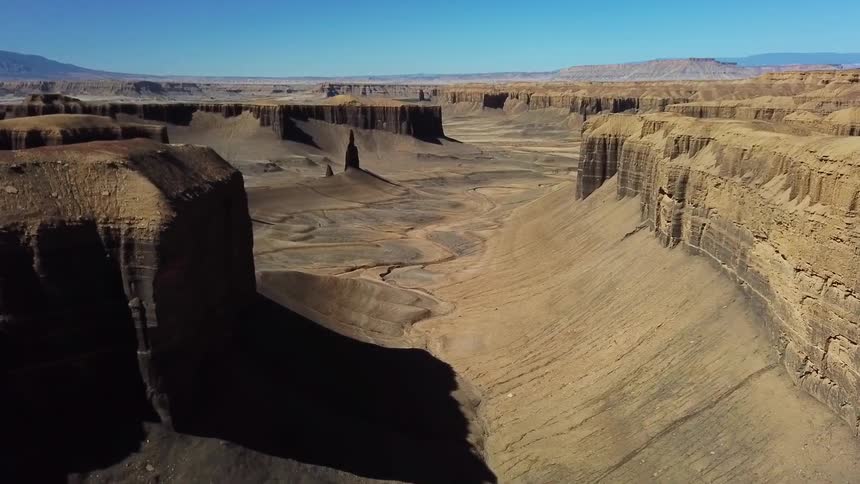 Large rock formations in dried up river canyon
