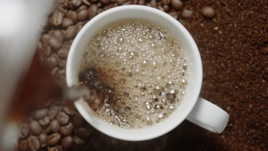 Coffee is poured into a mug