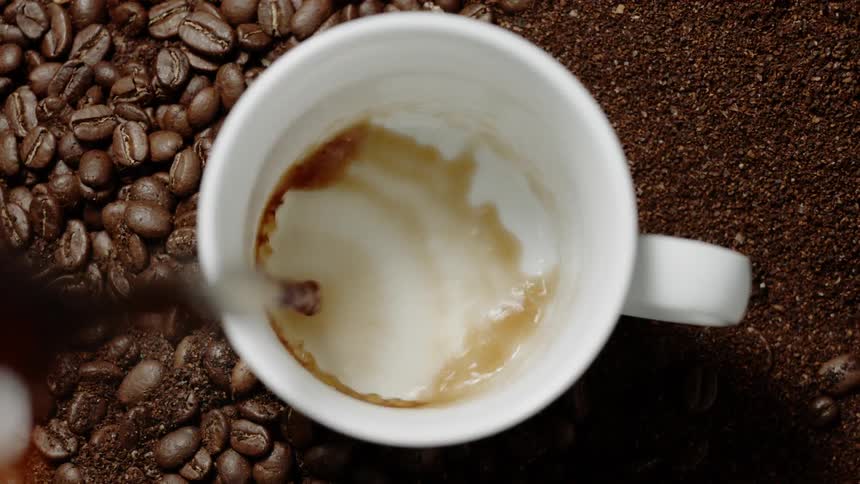Coffee is poured into a mug