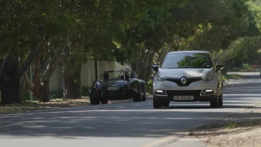 Cars drive on a road