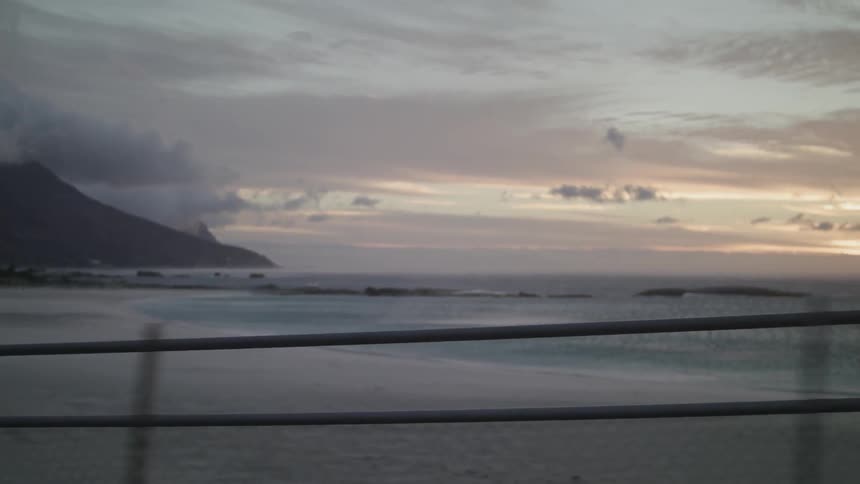 Sun sets over a large body of water