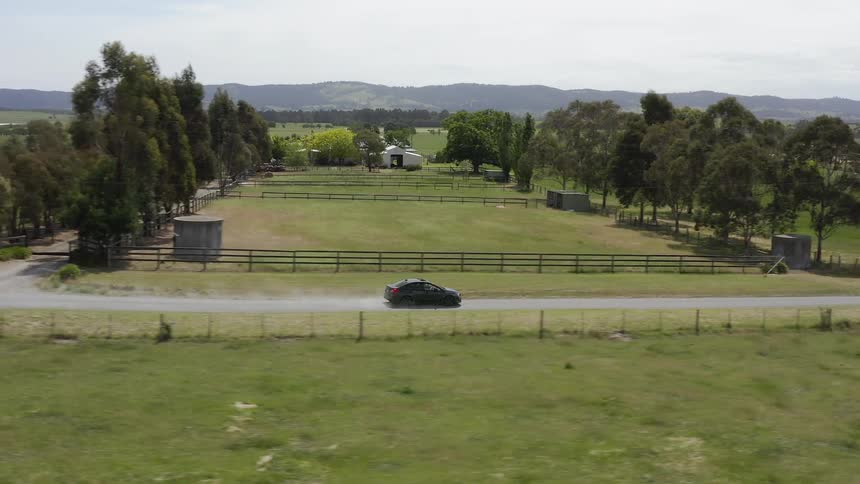 Car travels on a rural road