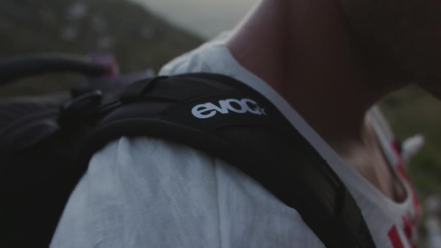 Person standing outside wearing a backpack