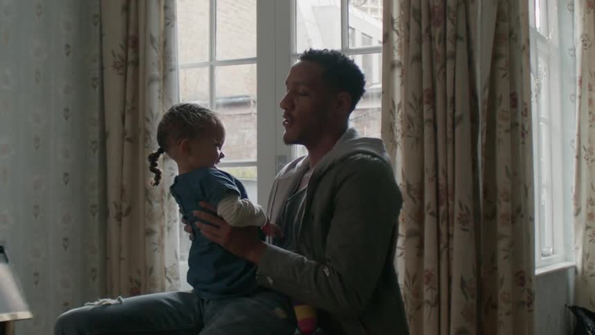 A man holds his daughter