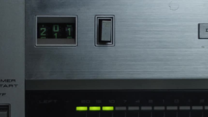 An Audio meter light glows on a piece of equipment