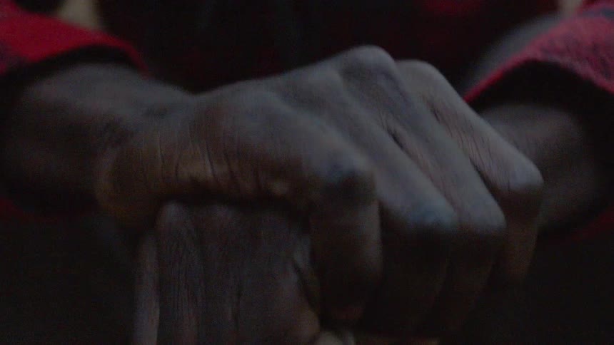 Two hands grip onto each other