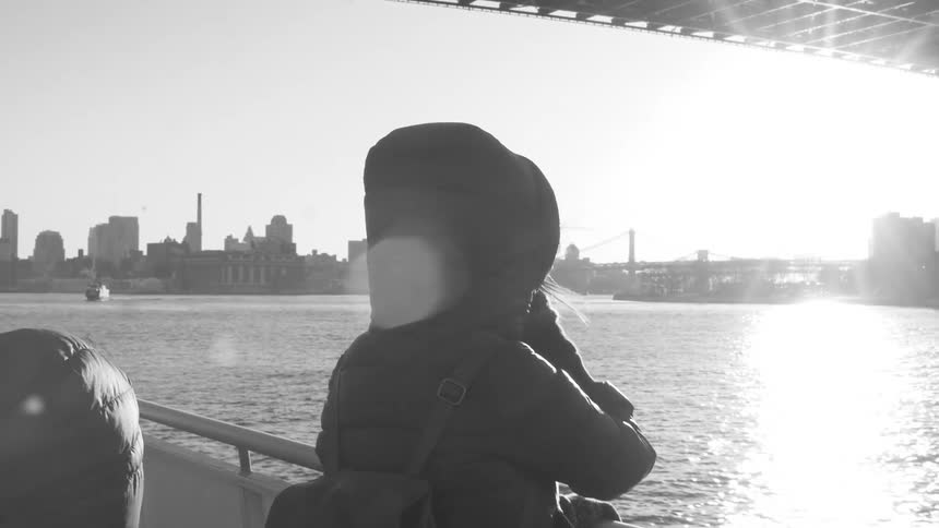 A person on a boat looking at the water