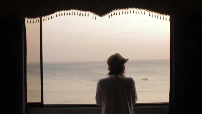 Woman looking out at the water
