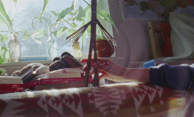 Young boy plays with a stick toy in his bedroom