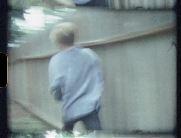 Children running and playing in a yard