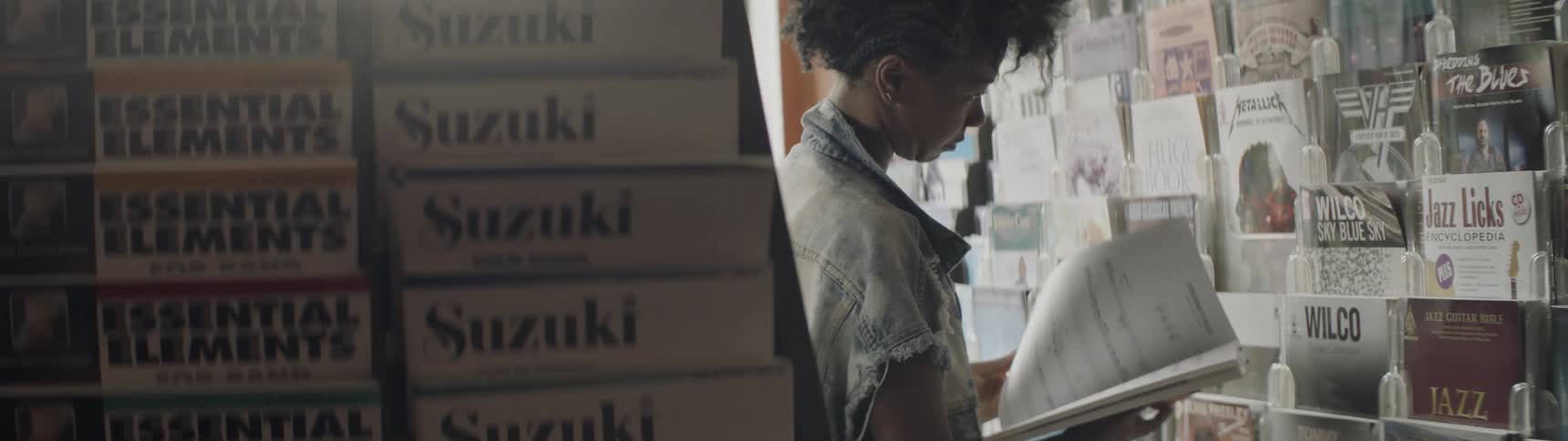 A woman browses records in a record shop