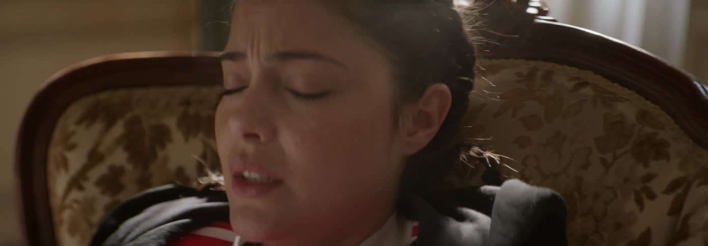 Woman with eyes closed looks worried