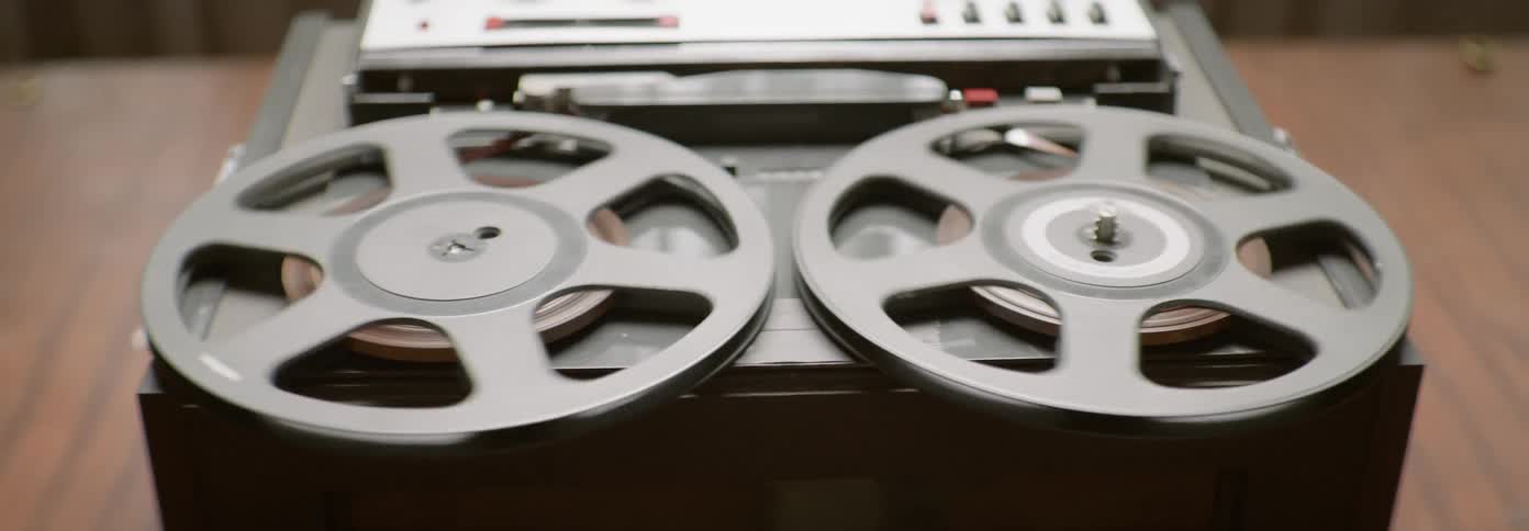 Reels of tape spin around