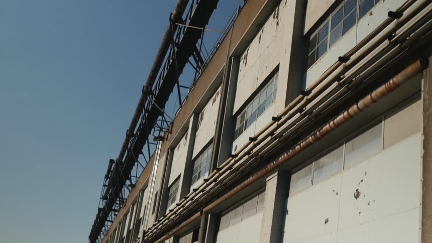 Exterior of a warehouse that is beside a river