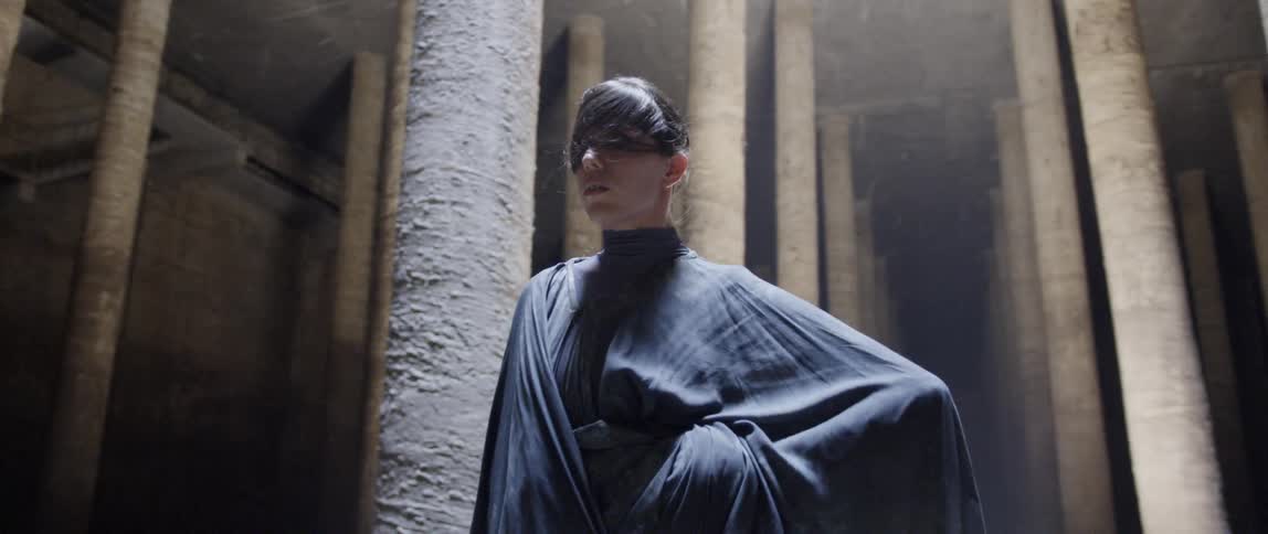 Woman dances in a cloak