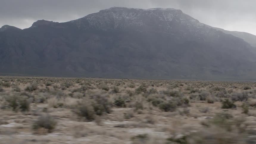 A tall mountain towers in the landscape