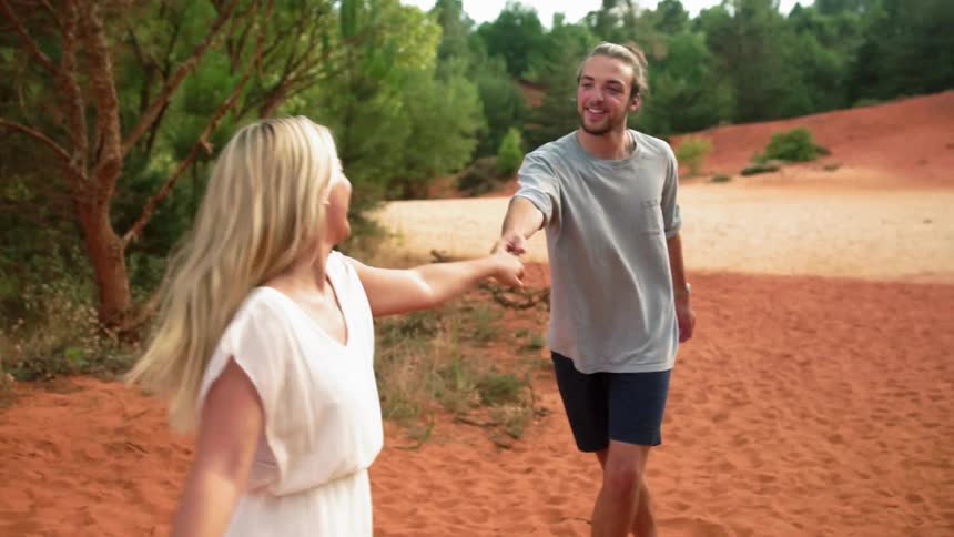 Man and woman dancing outdoors