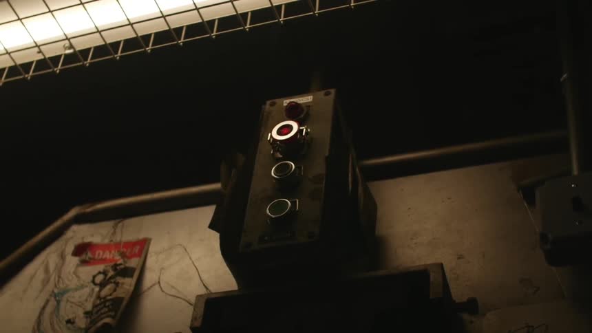 Single light above a switch on a wall