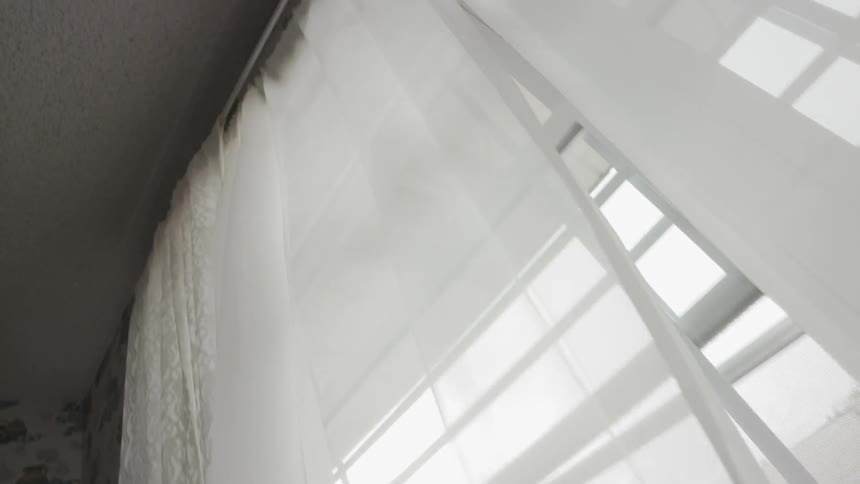 Curtains cover a window in a house