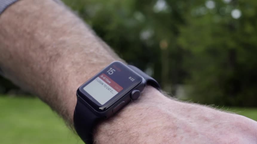 Man adjusts smartwatch