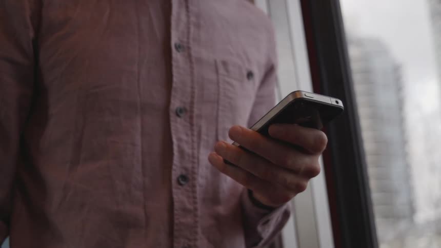 A man uses his cell phone