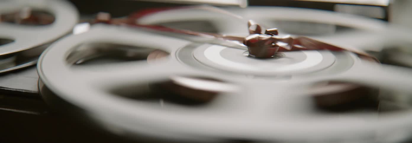 The tape from a reel to reel recorder gets tangled