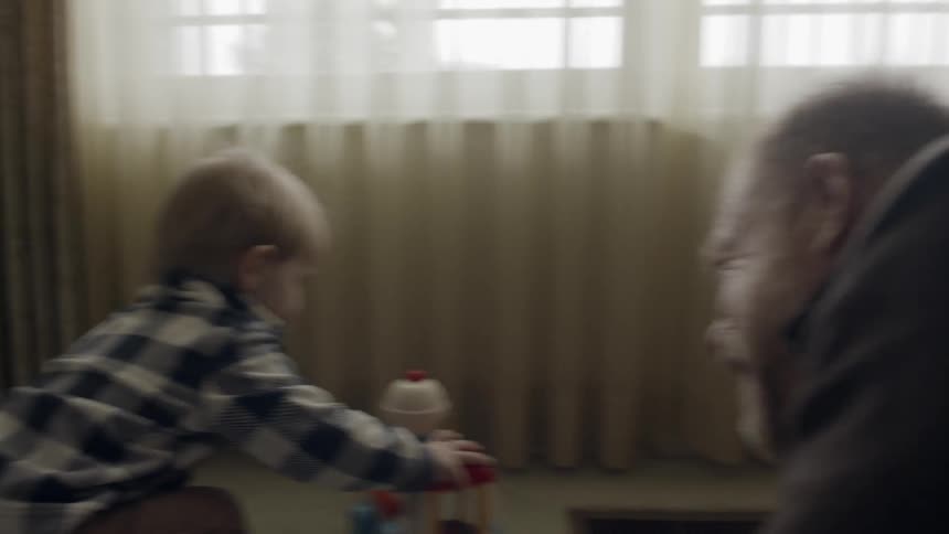 A man plays with a young child