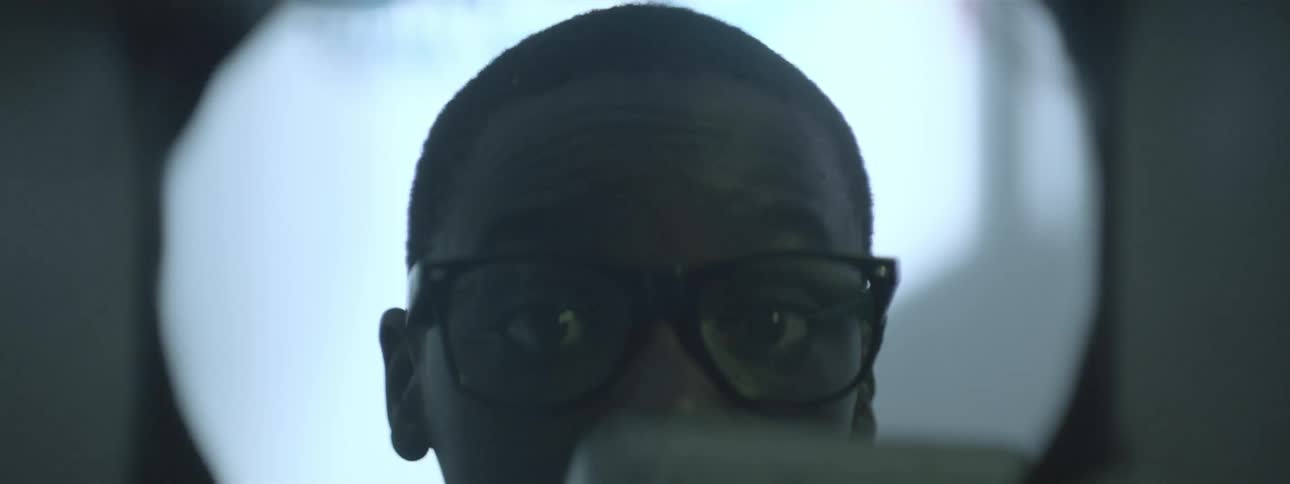 Close up of a boy placing something