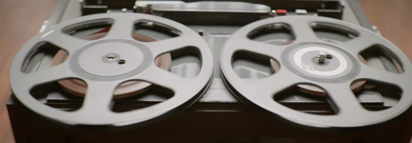 Two reels on an audio player spin around