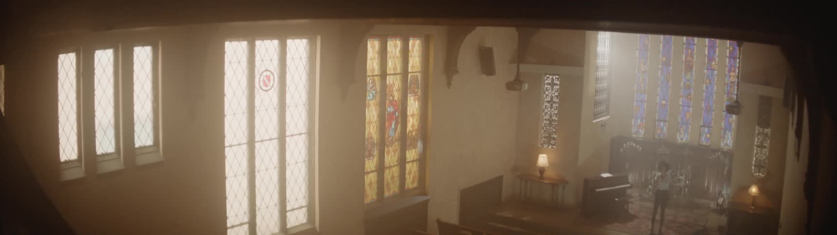 Ceiling fans run overhead in a large church
