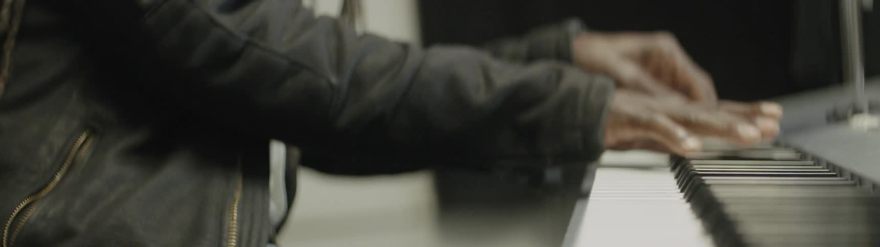 A person plays a piano