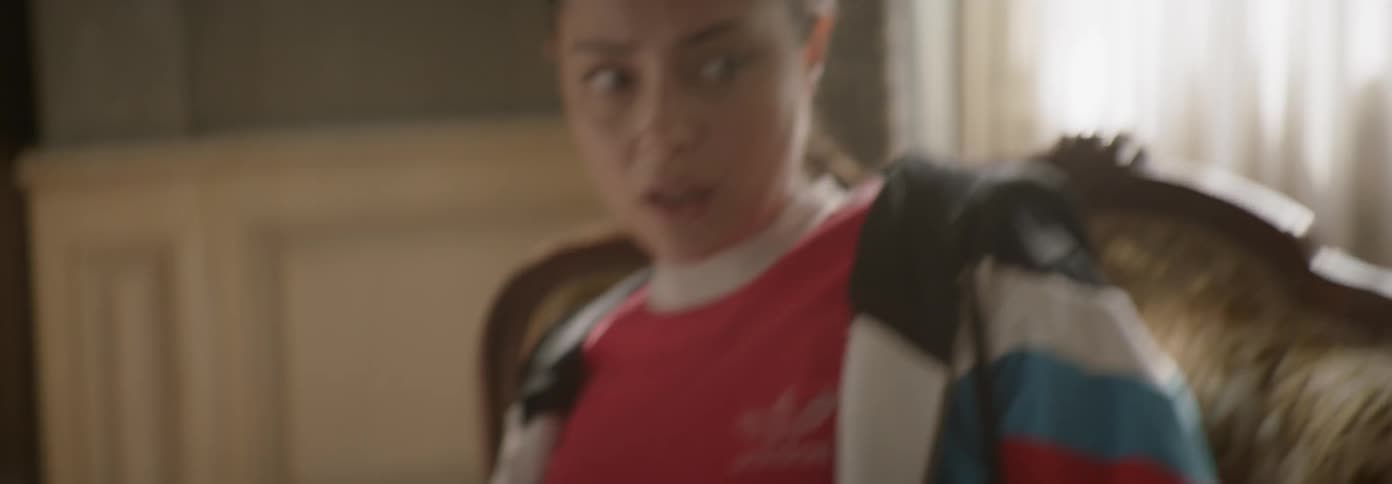 Scared looking woman breathes heaving and looks around