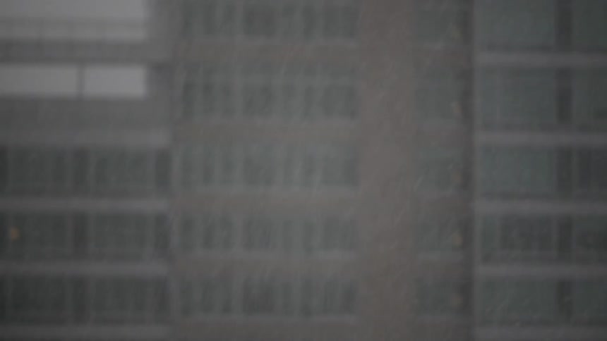 Snow falling in a city