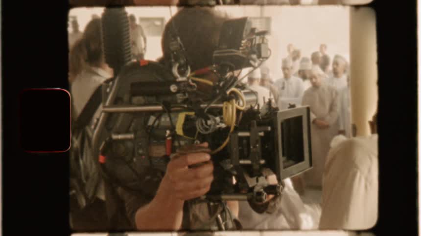 A film crew work outside at a market
