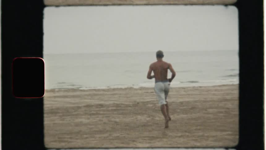 A man runs on the beach
