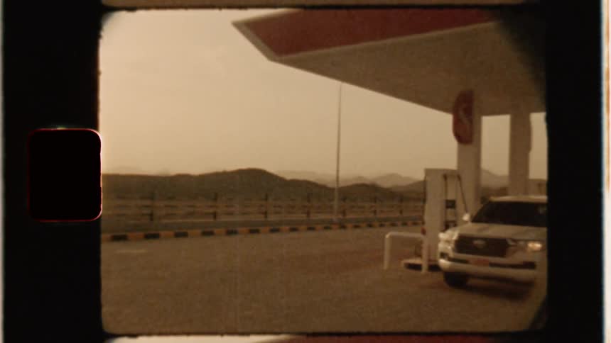 Cars fuel up at a gas station