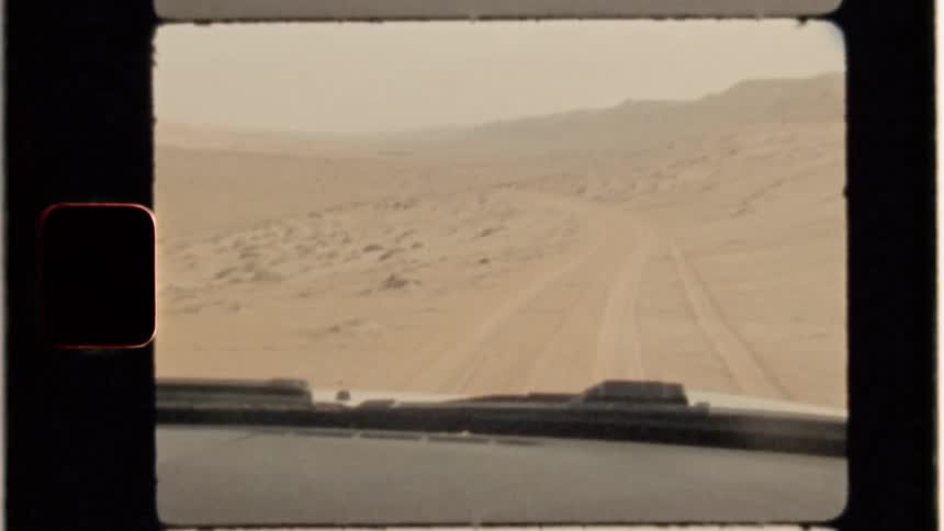 Vehicle travels through desert