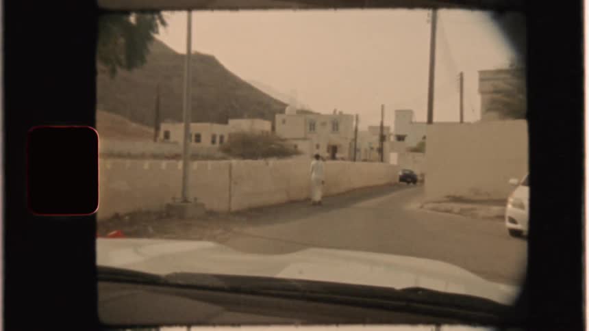 Car drives on a town road