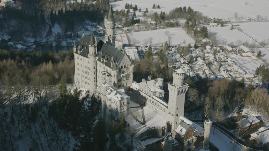 A large building sits atop the hill