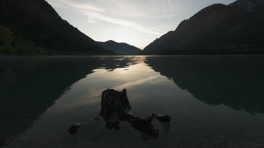 Water ripples on a mountain lake at sunrise