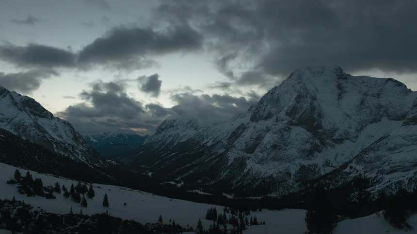 Clouds pass above the mountains