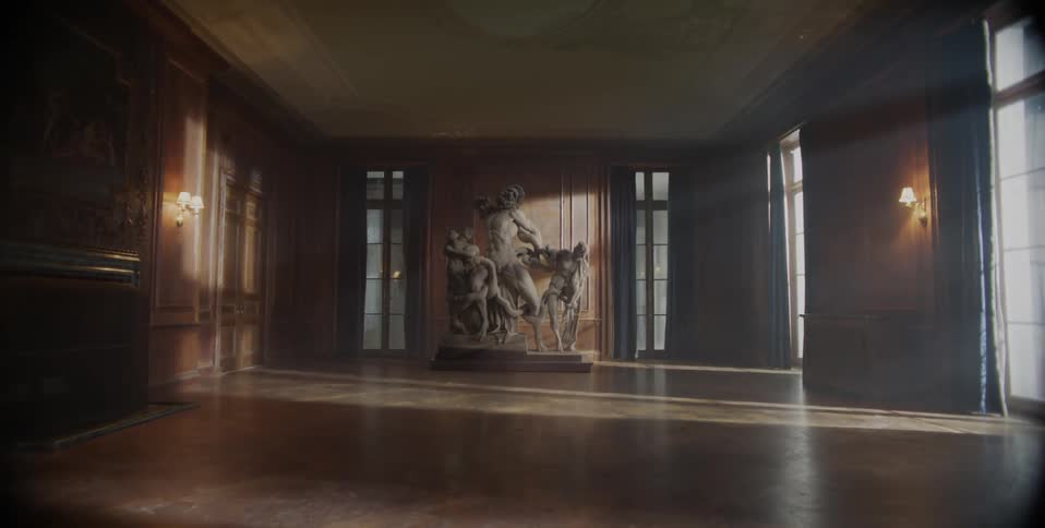 A statue sits in an empty room