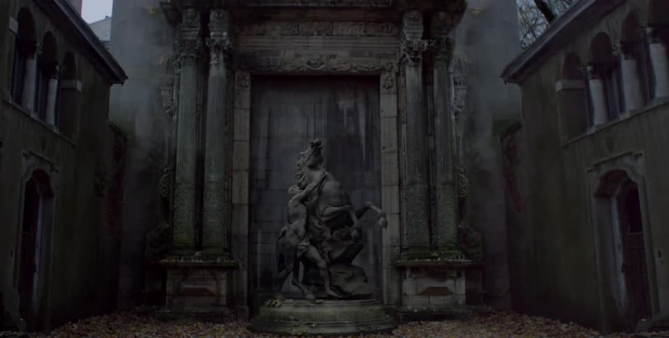 Statue of a horse and man sits in a building