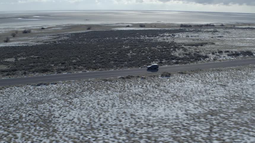 A car travels on a rural road